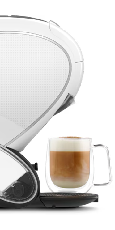 Une confrontation entre une machine à café NEO Latte blanche et une machine NEO Caffè noire. Un doigt d'alien flotte entre elles.